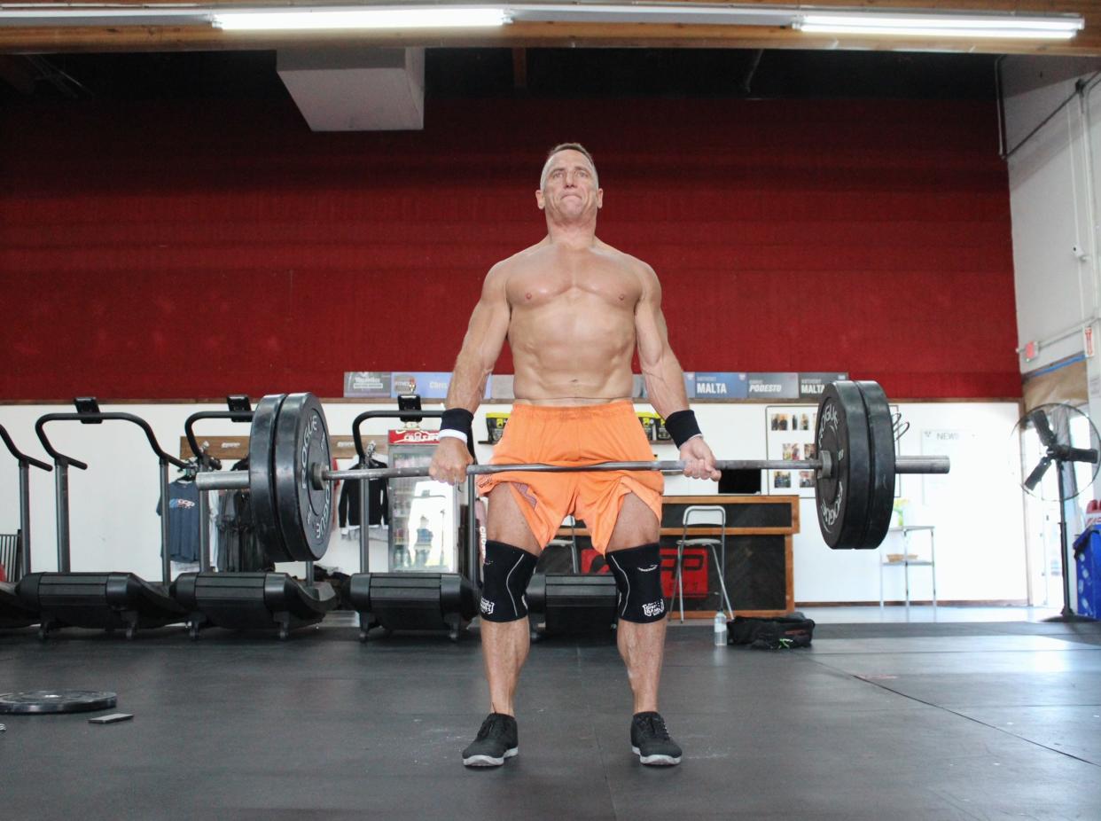 Chris Podesto performing a dead lift at ASAP Fitness gym located in Lodi.