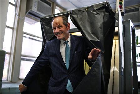 Former New York State Governor and current Democratic candidate for New York City Controller Eliot Spitzer emerges from a voting booth after casting his vote in the Democratic primary election on Manhattan's upper east side in New York, September 10, 2013. REUTERS/Mike Segar