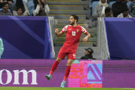 Jordan's Mahmoud Almardi celebrates his side's third goal during the Asian Cup Group E soccer match between Malaysia and Jordan at Al Janoub Stadium in Al Wakrah, Qatar, Monday, Jan. 15, 2024. (AP Photo/Aijaz Rahi)
