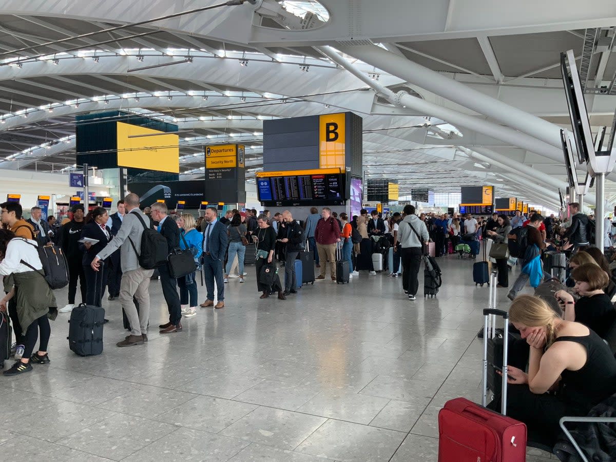 Passengers waiting to be rebooked at Heathrow after mass cancellations (Supplied)