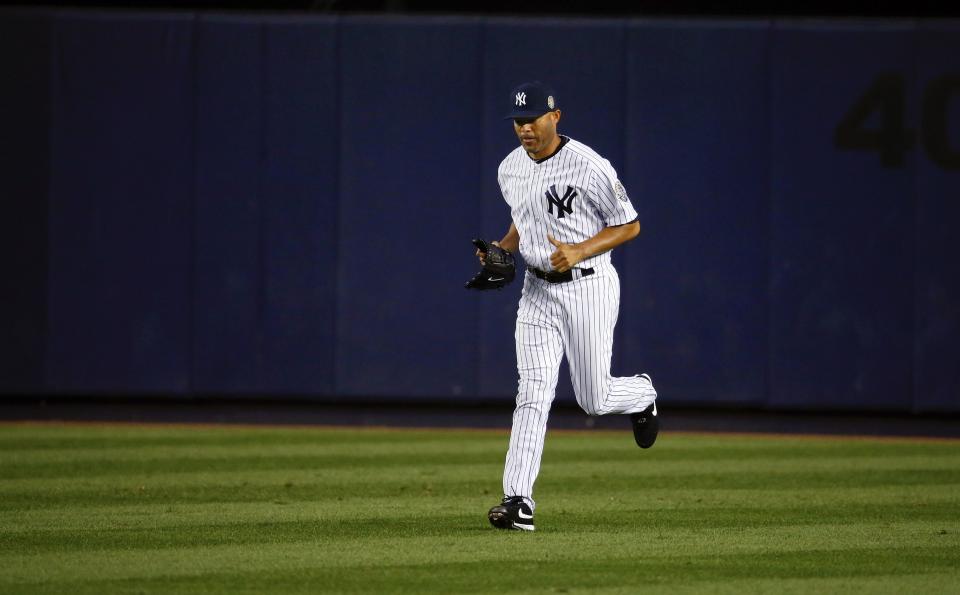 New York Yankees Rivera runs from the bullpen to the mound as he enters the game against the Tampa Bay Rays during their MLB American League game in New York