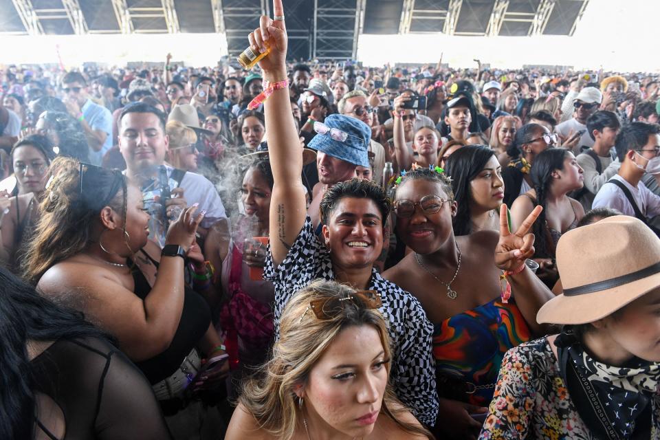 Fans of US rapper Latto wait for the start of her performance on the first weekend of the Coachella Valley Music and Arts Festival in Indio, California, on April 16, 2023. (Photo by VALERIE MACON / AFP) (Photo by VALERIE MACON/AFP via Getty Images)