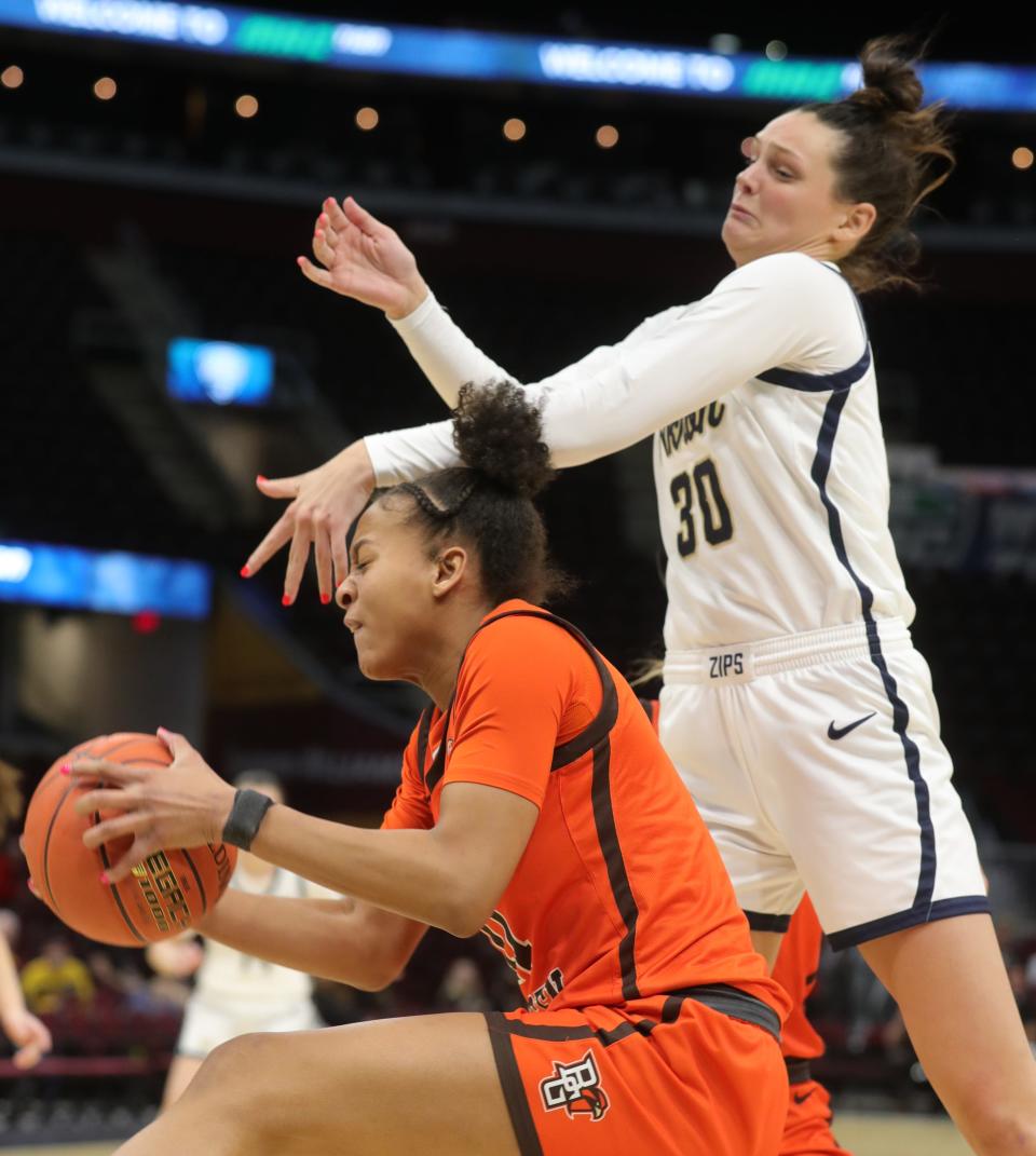 Bowling Green's Jocelyn Tate grabs a second half rebound in front of Akron's Layne Ferrell in a Mid American Conference Tournament quarterfinal game on Wednesday March 9, 2022 in Cleveland, Ohio, at Rocket Mortgage FieldHouse.