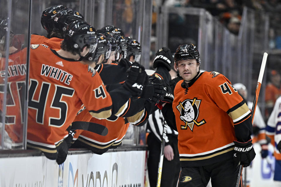 Anaheim Ducks left wing Max Jones, right, is congratulated after scoring against the New York Islanders during the first period of an NHL hockey game in Anaheim, Calif., Wednesday, March 15, 2023. (AP Photo/Alex Gallardo)