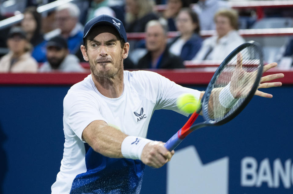 Andy Murray, of Britain, hits a backhand to Taylor Fritz, of the United States, during the National Bank Open tennis tournament Tuesday, Aug. 9, 2022, in Montreal. (Paul Chiasson/The Canadian Press via AP)