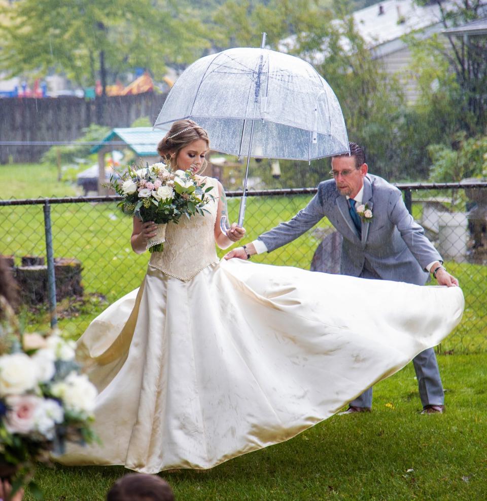 Cassie kept the lace-pattern bodice and skirt the same on her version of the wedding dress.