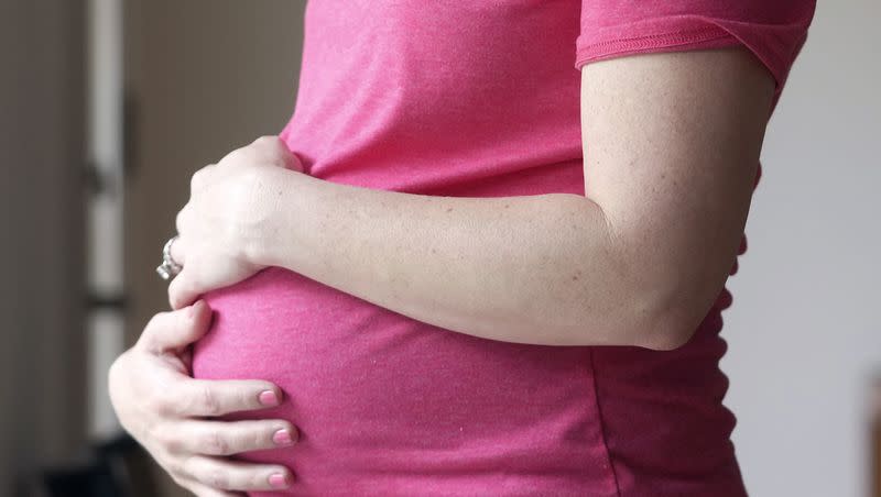 A pregnant woman stands for a portrait in Dallas, on May 18, 2023. On Friday, Aug. 4, 2023, U.S. health officials approved the first pill, Zurzuvae, specifically intended to treat severe depression after childbirth, a condition that affects thousands of new mothers in the U.S. each year.