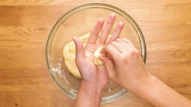 Rolling a ball of dough with hands