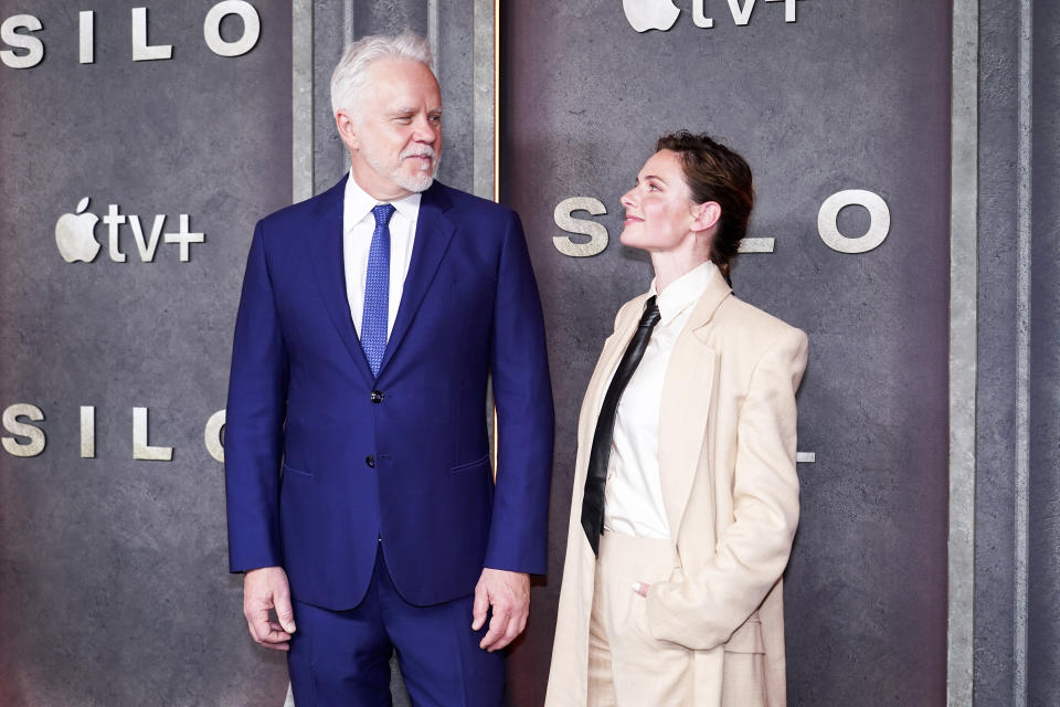 Actors Tim Robbins, left, and Rebecca Ferguson pose for photographers as they attend the premiere of Silo, in London, Tuesday, April 25, 2023.(Photo by Alberto Pezzali/Invision/AP)