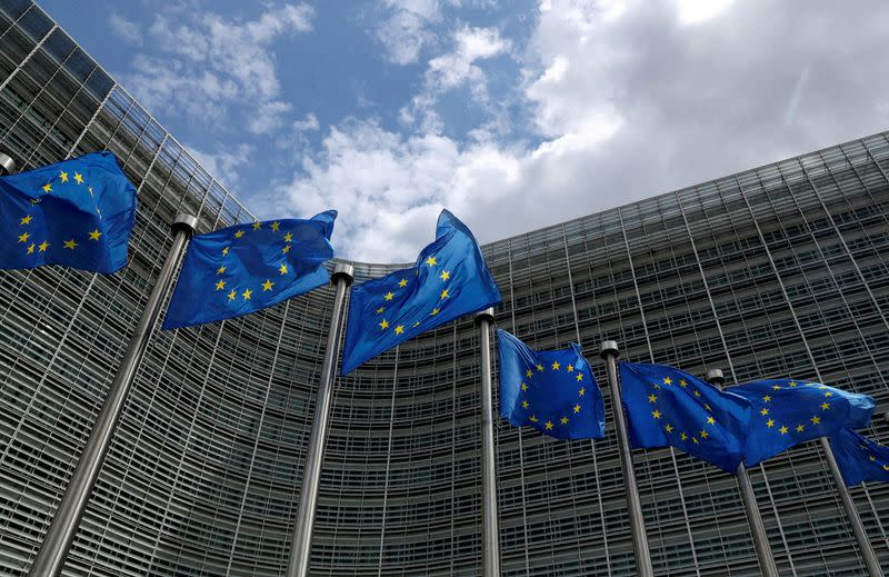 FILE PHOTO: European Union flags flutter outside the European Commission headquarters in Brussels