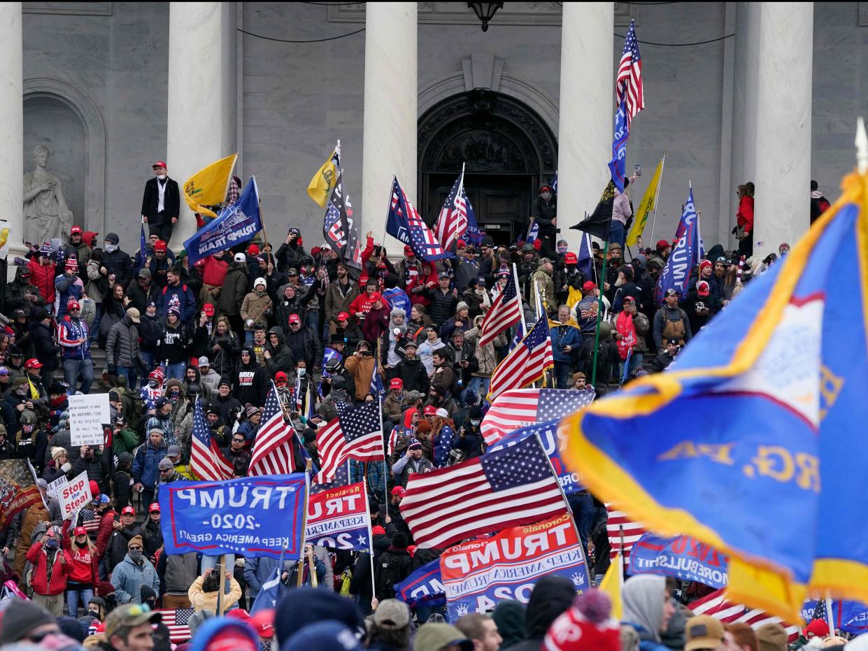 Rioters at the US Capitol on 6 January (AFP via Getty Images)