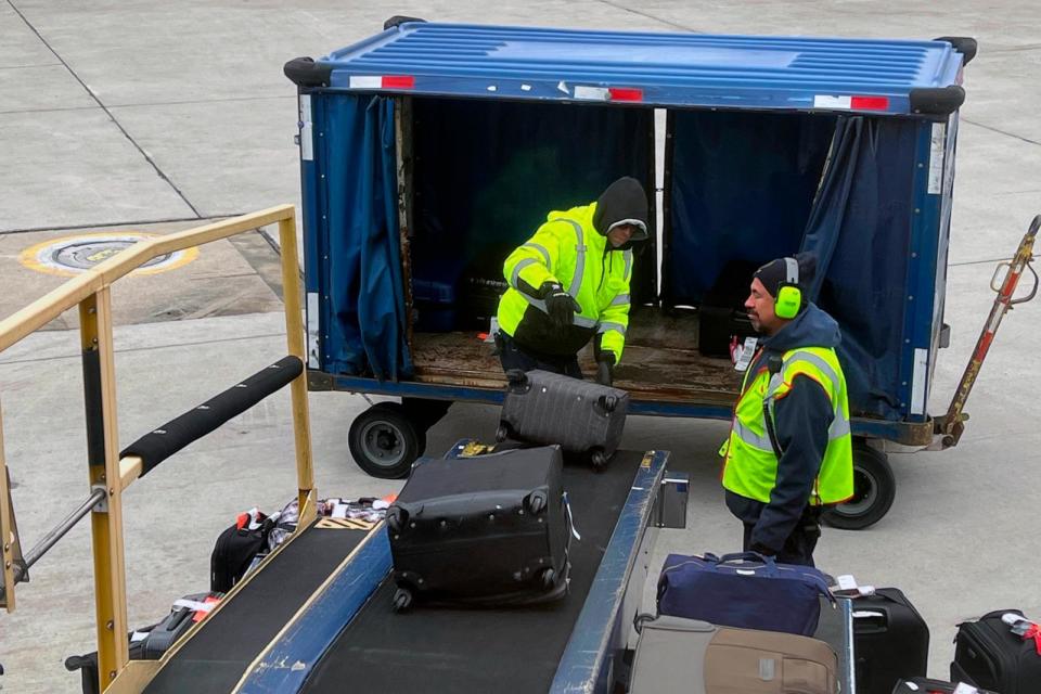 PHOTO: In this March 6, 2022 filre photo, American Airlines baggage handlers load luggage on an airplane at the O'Hare International Airport (ORD), in Chicago.  (Kirby Lee/AP. FILE)