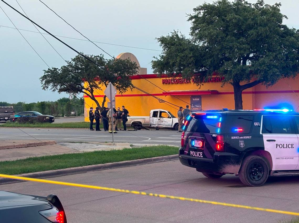 Police officers and firefighters at the scene where injuries were reported following a vehicle crash during a police pursuit on Hemphill Street in south Fort Worth on Monday night, May 6, 2024.