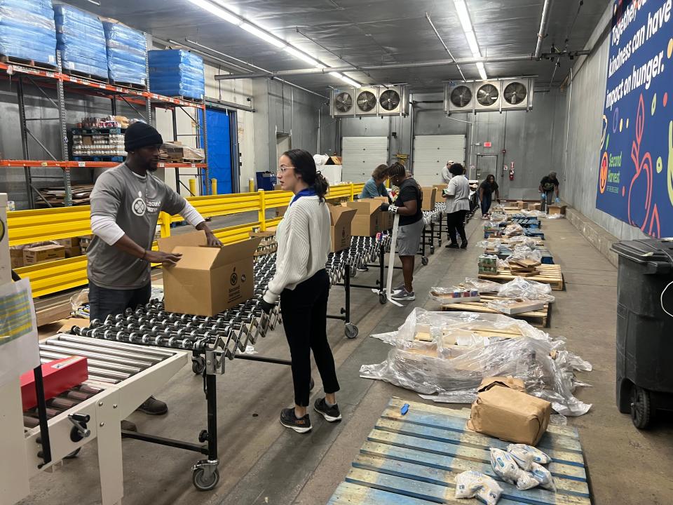 Second Harvest volunteers packaging food