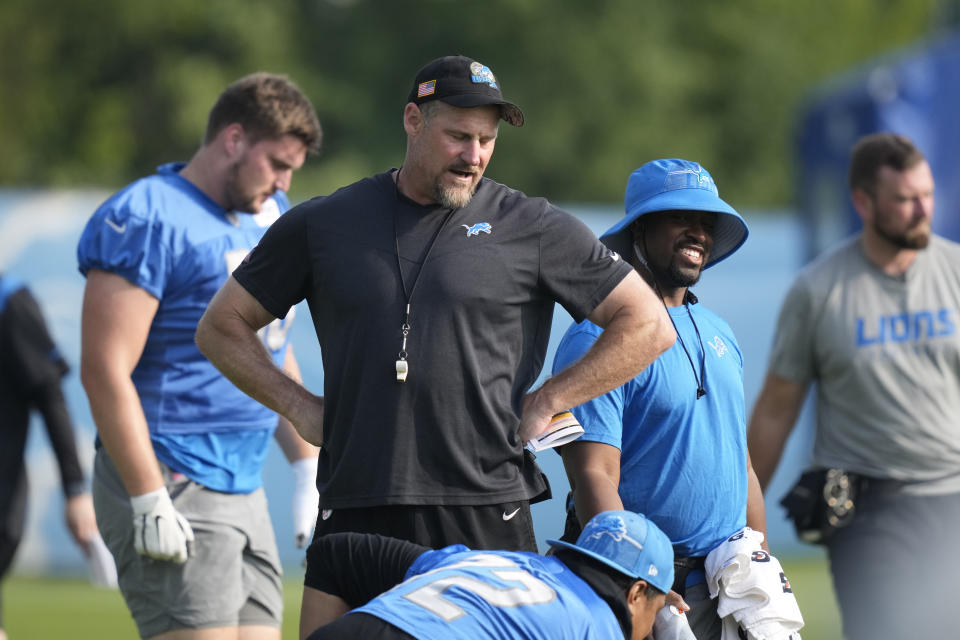 Detroit Lions head coach Dan Campbell checks on his players before a drill at an NFL football practice, Wednesday, July 26, 2023, in Allen Park, Mich. (AP Photo/Carlos Osorio)