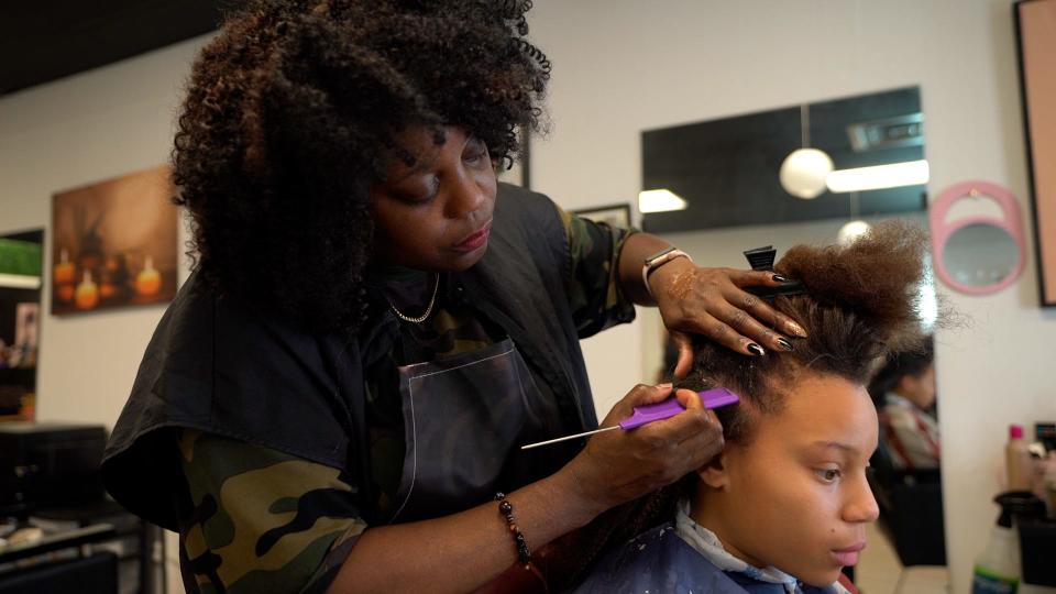 Diversity Hair Salon owner Jacqueline Gibson styles hair on Jan. 28.