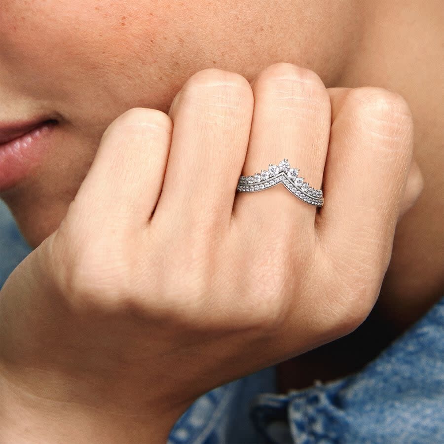 model wearing silver and diamond wishbone ring