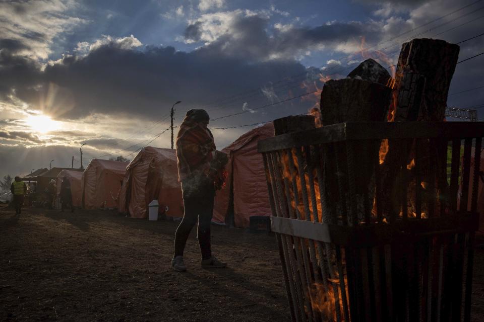 People at a makeshift camp wait to board a train heading for Krakow, after fleeing from Ukraine, at the border crossing in Medyka, Poland, Thursday, March 10, 2022. (AP Photo/Visar Kryeziu)