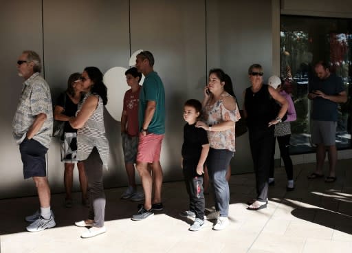 Shoppers queueing outside an Apple store in Naples, Florida during Black Friday sales in November 2017: experiments show that the longer people remain in line, the more likely they are to stay in line