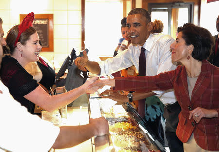 U.S. President Barack Obama joins Rhode Island candidate for Governor Gina Raimondo (R) at Gregg's Restaurant in Providence, Rhode Island, October 31, 2014. REUTERS/Larry Downing