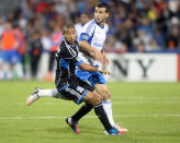 MONTREAL, CANADA - AUGUST 18: Felipe Martins #7 of the Montreal Impact battles for position with Justin Morrow #15 of the San Jose Earthquakes during the match at the Saputo Stadium on August 18, 2012 in Montreal, Quebec, Canada. The Impact defeated the Earthquakes 3-1. (Photo by Richard Wolowicz/Getty Images)