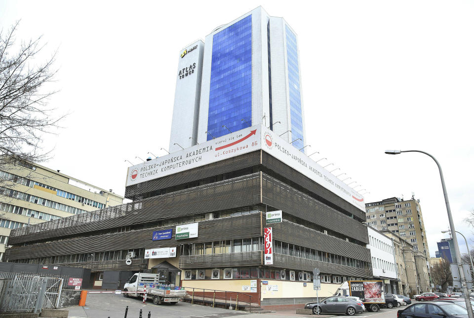 The run-down metal-and-glass headquarters of Poland's ruling Law and Justice party that also holds the heavily-guarded office in Warsaw, Poland, Monday, Feb. 11, 2019 of the party leader Jaroslaw Kaczynski. Kaczynski, whose public image is of restraint and honesty, is at the center of a scandal involving him negotiating a multi-million euro construction project, even though the law bans political parties from doing business. (AP Photo/Czarek Sokolowski)