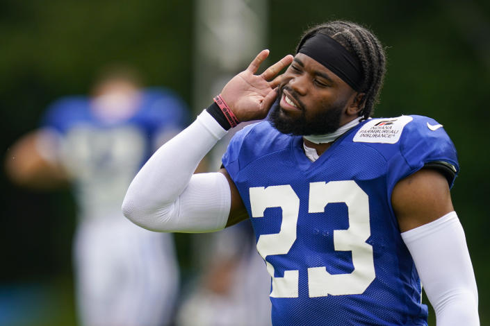 Indianapolis Colts cornerback Kenny Moore II (23) listens to the crowd during practice at the NFL team's football training camp in Westfield, Ind., Tuesday, Aug. 2, 2022. (AP Photo/Michael Conroy)