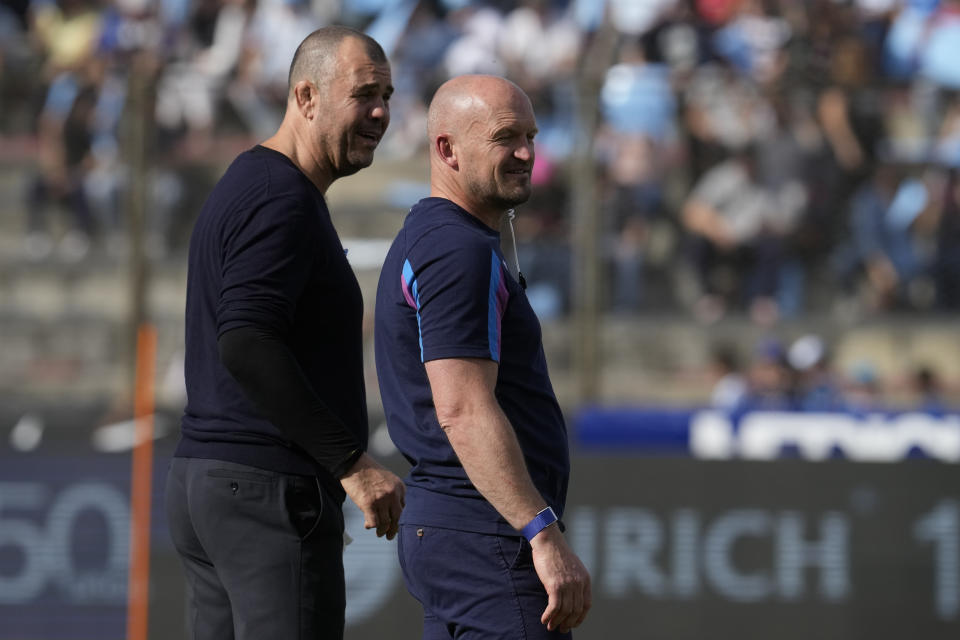 Scotland's head coach Gregor Townsend, right, and Michael Cheika, head coach of Argentina stands on the field prior to their rugby test match in Salta, Argentina, Saturday, July 9, 2022. (AP Photo/Natacha Pisarenko)
