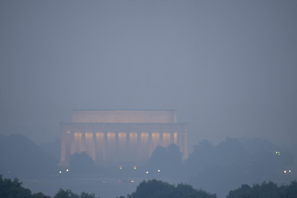 <p>Haze blankets the Lincoln Memorial on the National Mall in Washington, Thursday, June 8, 2023, as seen from Arlington, Va. Smoke from Canadian wildfires is pouring into the U.S. East Coast and Midwest and covering the capitals of both nations in an unhealthy haze. (AP Photo/Alex Brandon)</p> 
