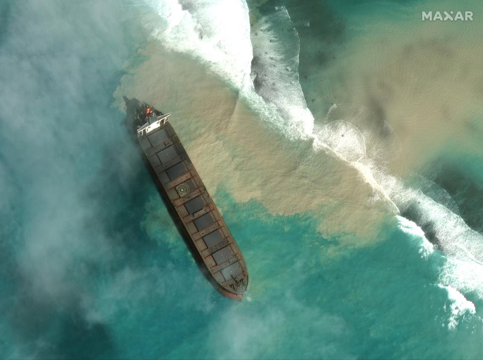 In this satellite image provided by 2020 Maxar Technologies on Friday, Aug. 7, 2020, an aerial view of the MV Wakashio, a bulk carrier ship that recently ran aground off the southeast coast of Mauritius. The prime minister of Mauritius says the government is appealing to France for help with a brewing environmental disaster after a ship that ran aground almost two weeks ago off the Indian Ocean island nation began leaking oil. Prime Minister Pravind Jugnauth said Friday that the leak “represents a danger for Mauritius" and that his country doesn’t have the skills and expertise to refloat stranded ships. ( 2020 Maxar Technologies. via AP)