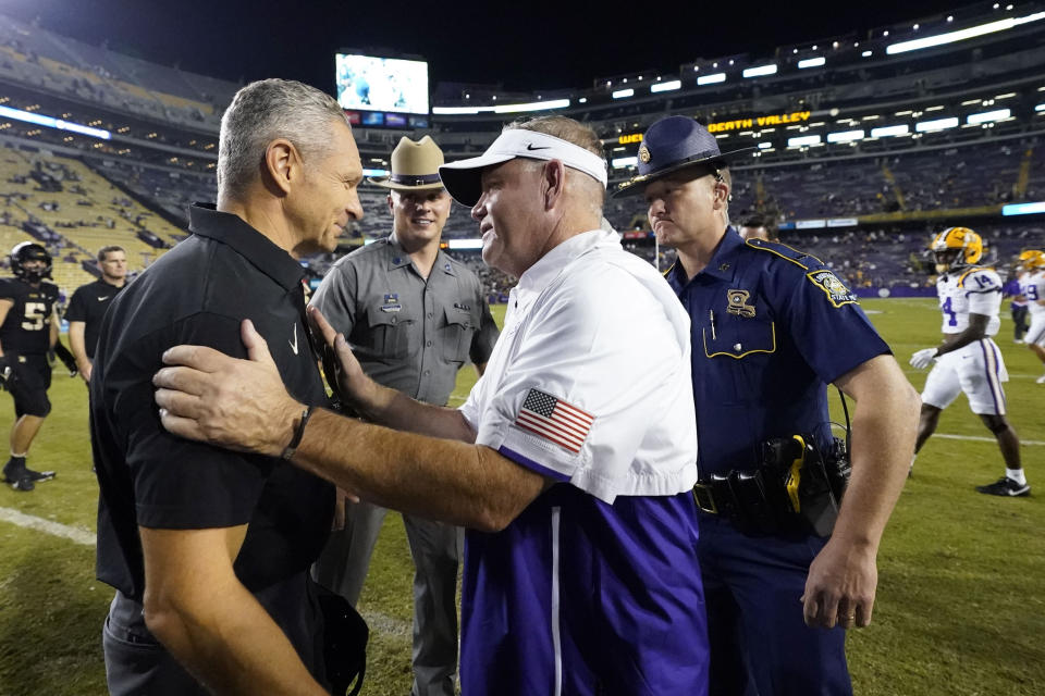 LSU head coach Brian Kelly, right, greets Army head coach Jeff Monken after an NCAA college football game in Baton Rouge, La., Saturday, Oct. 21, 2023. LSU won 62-0. (AP Photo/Gerald Herbert)