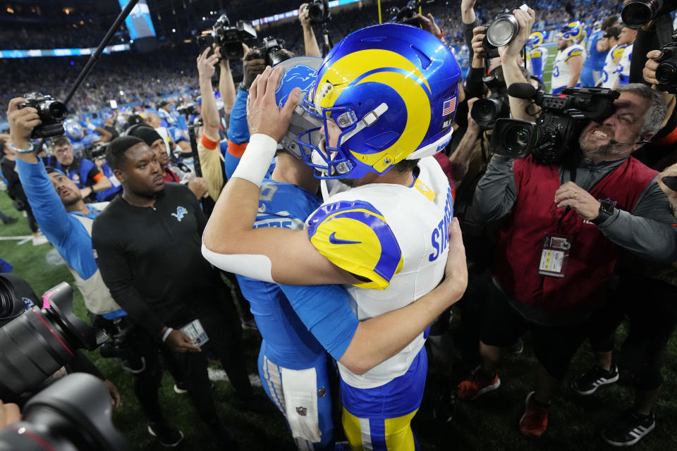 Detroit Lions quarterback Jared Goff, left greets Los Angeles Rams quarterback Matthew Stafford after the second half of an NFL wild-card playoff football game, Sunday, Jan. 14, 2024, in Detroit. The Lions won 24-23. (AP Photo/Paul Sancya)