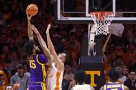 LSU center Efton Reid (15) shoots over Tennessee forward Uros Plavsic (33) during the first half of an NCAA college basketball game Saturday, Jan. 22, 2022, in Knoxville, Tenn. (AP Photo/Wade Payne)