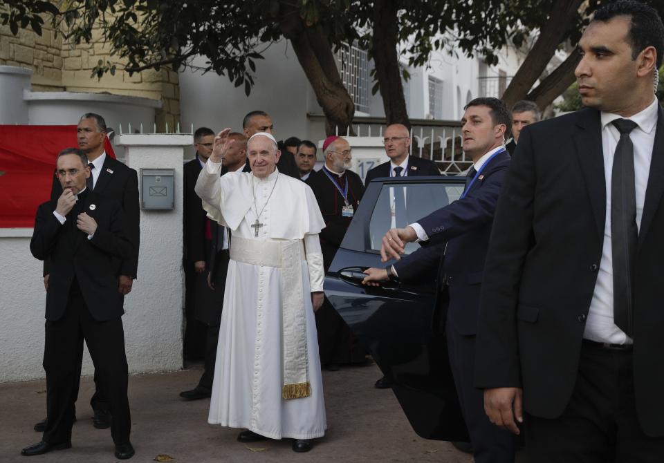 Pope Francis waves upon his arrival at the diocesan Caritas center in Rabat, Morocco, Saturday, March 30, 2019. Francis's weekend trip to Morocco aims to highlight the North African nation's tradition of Christian-Muslim ties while also letting him show solidarity with migrants at Europe's door and tend to a tiny Catholic flock on the peripheries. (AP Photo/Gregorio Borgia)