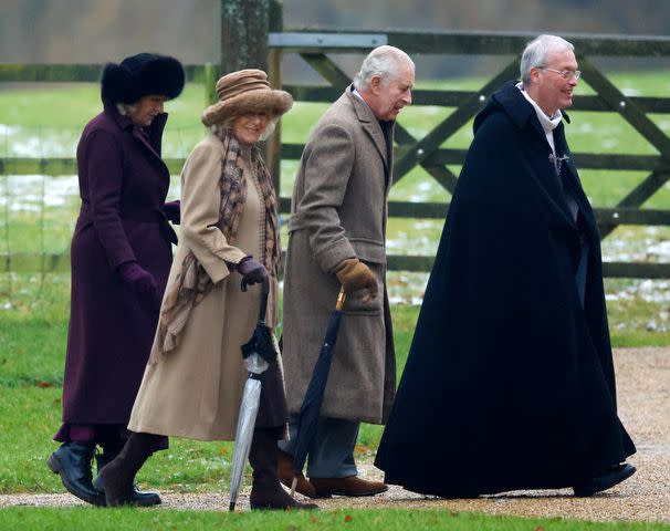 <p>Max Mumby/Indigo/Getty</p> King Charles and Queen Camilla walk from St Mary Magdalene near Sandringham House on Dec. 3.