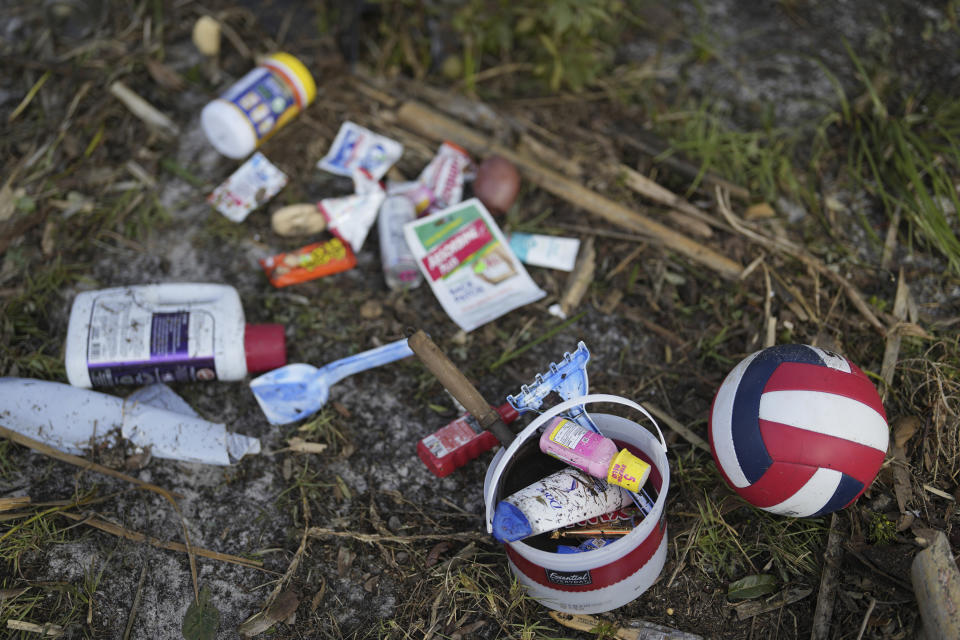 A few personal belongings salvaged from amidst the wreckage of a destroyed home lie gathered together in Horseshoe Beach, Fla., Thursday, Aug. 31, 2023, one day after the passage of Hurricane Idalia. (AP Photo/Rebecca Blackwell)