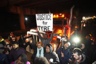 Protesters march down the street Friday, Jan. 27, 2023, in Memphis, Tenn., as authorities release police video depicting five Memphis officers beating Tyre Nichols, whose death resulted in murder charges and provoked outrage at the country's latest instance of police brutality. (AP Photo/Gerald Herbert)