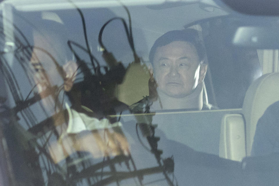 FILE - Former Thai Prime Minister Thaksin Shinawatra, right, sitting in a vehicle, leaves after being released from Police General Hospital on parole in Bangkok, Thailand, Sunday, Feb. 18, 2024. Thaksin, the Southeast Asian nation’s most controversial politician for more than two decades, was released on parole early Sunday from a Bangkok hospital where he spent six months serving time for corruption-related offenses. (AP Photo/Sakchai Lalit, File)
