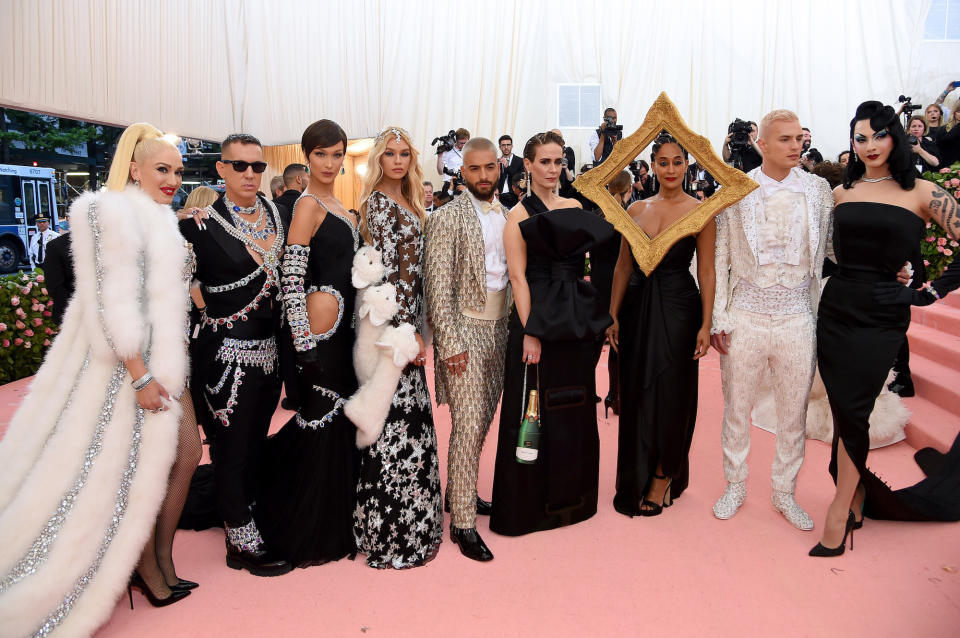 group photo at the met gala including Gwen Stefani, Jeremy Scott, Bella Hadid, Maluma, Saarah Paulson, Tracee Ellis Ross, and others