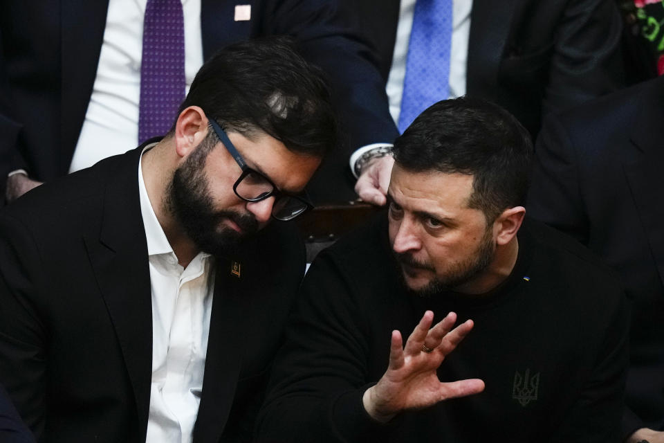 Chile's President Gabriel Boric, right, talks to Ukrainian President Volodymyr Zelenskyy during the swearing-in ceremony for new Argentina's President Javier Milei at Congress in Buenos Aires, Argentina, Sunday, Dec. 10, 2023. (AP Photo/Natacha Pisarenko)