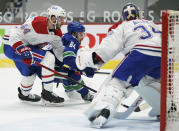 Montreal Canadiens defenseman Joel Edmundson (44) checks Vancouver Canucks centre Tyler Motte (64) in front of Canadiens goaltender Jake Allen (34) during the second period of an NHL hockey game Thursday, Jan. 21, 2021, in Vancouver, British Columbia. (Jonathan Hayward/The Canadian Press via AP)