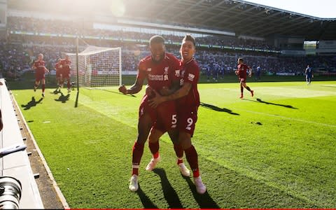 eorginio Wijnaldum of Liverpool celebrates scoring their 1st goal with Roberto Firmino during the Premier League match between Cardiff City and Liverpool - Credit: OFFSIDE