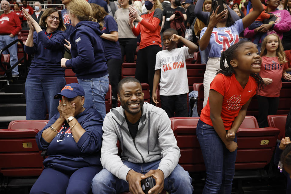 Daisy McPhee, left, mother of Mississippi head coach Yolett McPhee-McCuin, and daughter Yasmine McCuin, right, reacts after Mississippi won at the end of the second half of a second-round college basketball game in the women's NCAA Tournament, Sunday, March 19, 2023, in Stanford, Calif. (AP Photo/Josie Lepe)
