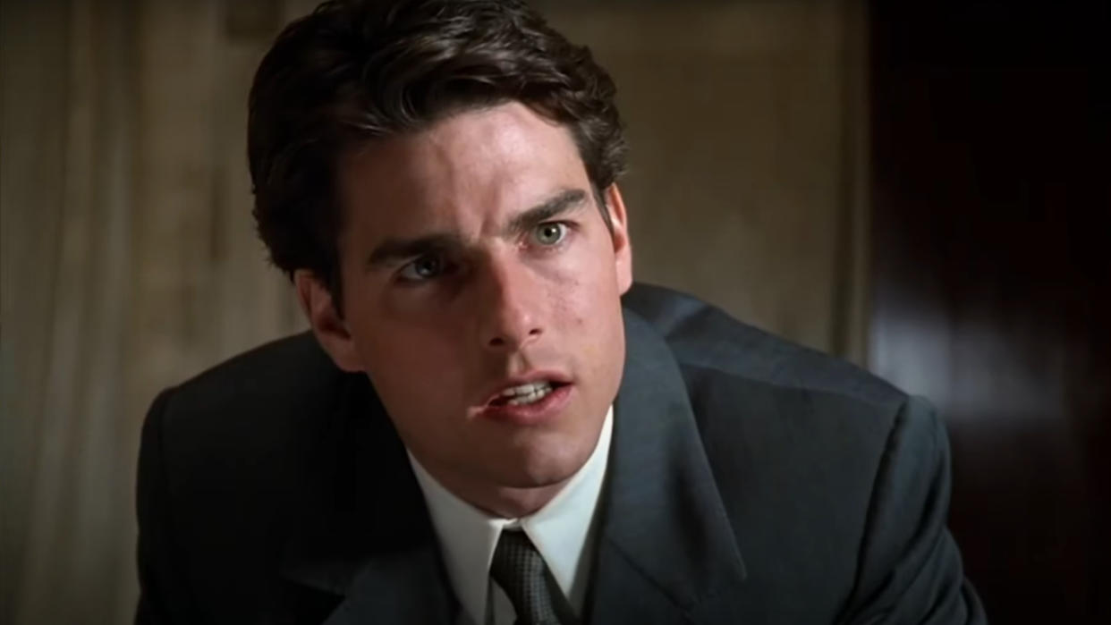  Tom Cruise sits with a nervous look on his face in The Firm. 