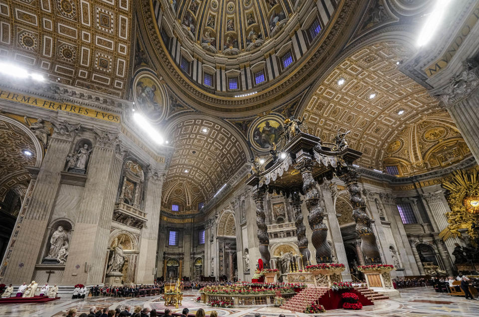 Pope Francis, sitting at left, presides over the first Vespers and the 'Te Deum' in St. Peter's Basilica Saturday, Dec. 31, 2022. Pope Emeritus Benedict XVI, the German theologian who will be remembered as the first pope in 600 years to resign, has died, the Vatican announced Saturday. He was 95. (AP Photo/Andrew Medichini)