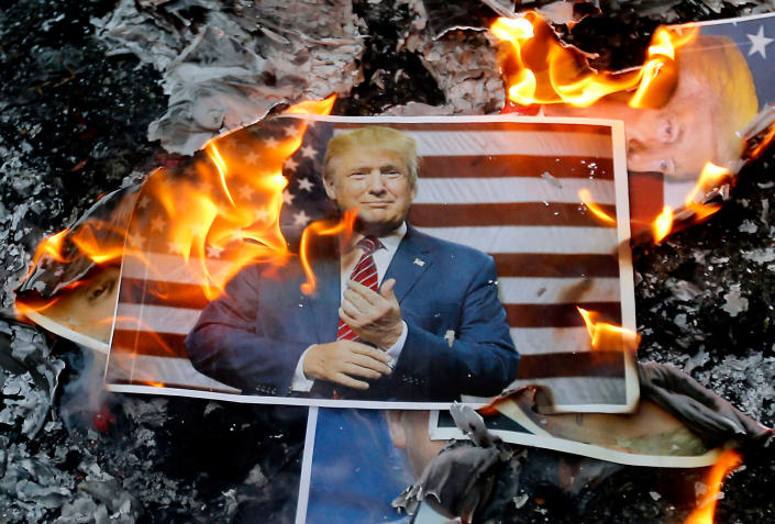<p>DEC. 11, 2017 – A portrait of US President Donald Trump burns during a demonstration in the capital Tehran, Iran to denounce his declaration of Jerusalem as Israel’s capital. (Photo: Atta Kenare/AFP/Getty Images) </p>