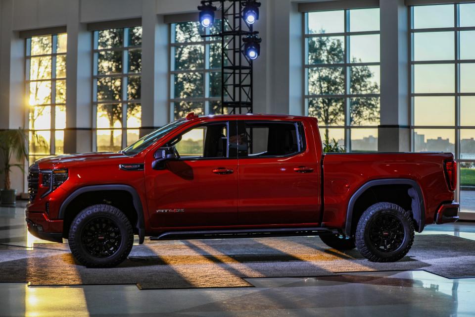 2022 GMC Sierra Ultimate and AT4X trim features a new a unique grille in exclusive Vader chrome, along with exclusive 22-inch wheels, and a revised headlamp design and expressive lighting animation when approaching, starting or walking away from the vehicle are on display in Detroit on Tuesday, Oct. 19, 2021. GMC’s six-way MultiPro tailgate, the Denali Premium Suspension with segment-exclusive Adaptive Ride Control, and power assist steps are standard.