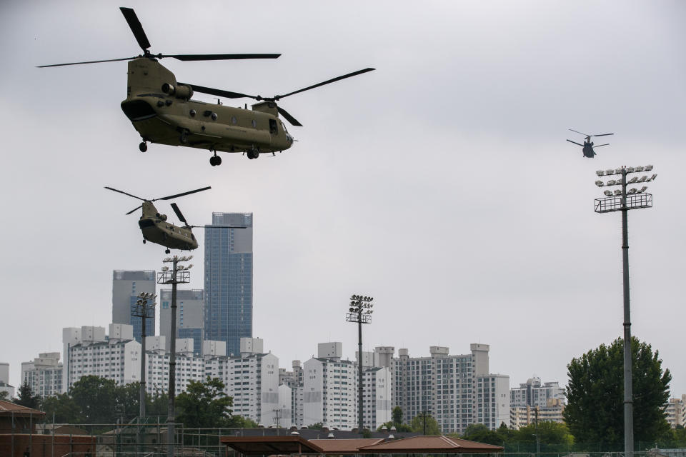 Support helicopters follow the Marine One helicopter carrying President Donald Trump to the demilitarized zone (DMZ) as they take off from Seoul, South Korea, Sunday, June 30, 2019. (AP Photo/Jacquelyn Martin, Pool)