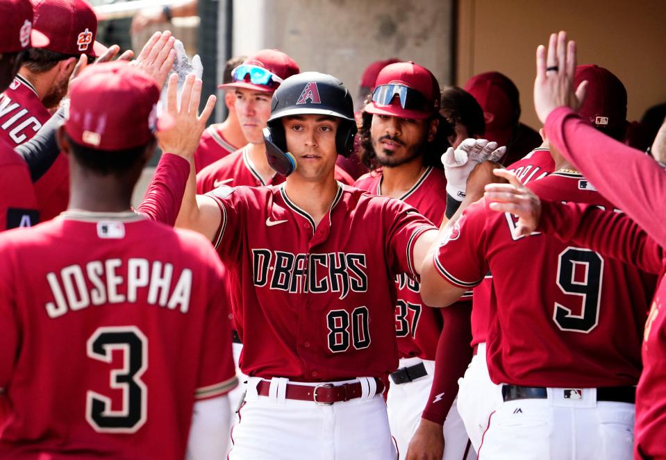 Arizona Diamondbacks Dominic Canzone (80) reacts after hitting a home run against the Los Angeles Dodgers in the first inning of a spring training game in Scottsdale on March 23.