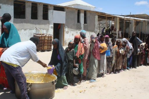 Somali children receive food ration at a feeding center in the southern Mogadishu district of Howlwadag in April. Anti-poverty campaigners are urging leaders of rich nations to commit at a weekend summit to feeding the world's poor, warning that hunger is taking a devastating toll away from the headlines